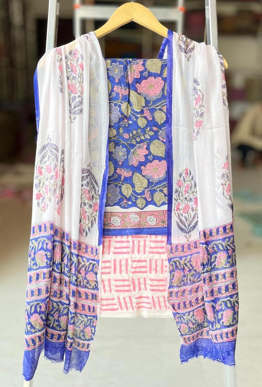 Traditional patterned dress on a hanger with a blurred background