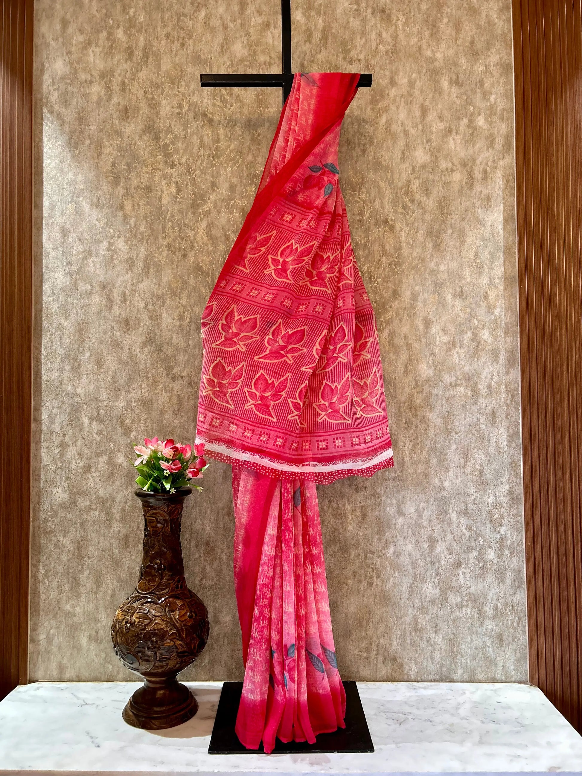 Pink saree with white patterns