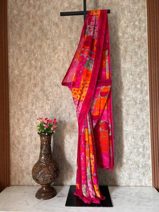 Colorful fabric on a stand with a decorative vase and flowers on a textured surface