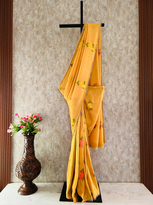 Yellow color Designer saree with pearl work